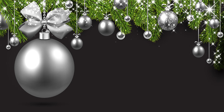 Grey background with silver Christmas ball.