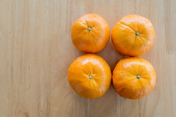 orange fruits on the wood table, Healthy fruits concept.