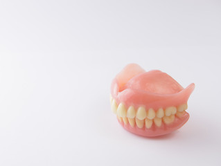 False teeth on white background