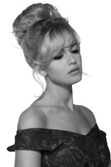 portrait of a beautiful blonde woman in retro dress 50-s style . monochrome black and white photo