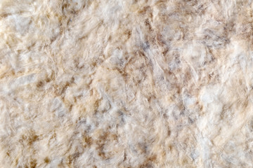 Noise insulation of walls.
Horizontally, the front view. Sound absorbing mats made of stone wool are attached to the wall of the living room.