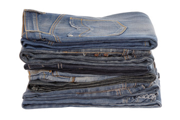 isolated heap of blue jeans, a pile of jeans-wear is on white