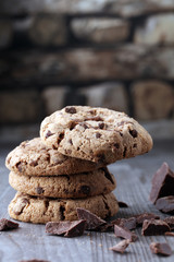 Chocolate cookies on wooden table. Chocolate chip cookies shot.
