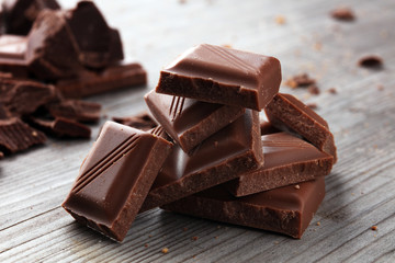 Dark Chocolate chunks and stacked broken chocolate bar.