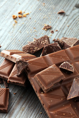 Dark Chocolate chunks and stacked broken chocolate bar.