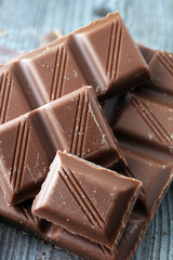 Dark Chocolate chunks and stacked broken chocolate bar.