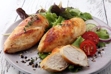 Grilled Chicken Breast with Salad and cherry tomatoes.