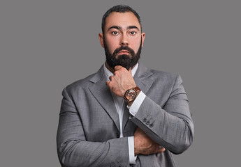 Fototapeta premium Serious, bearded male dressed in a suit.