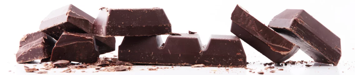 Fototapeten close up of chocolate bars isolated on white background © beats_