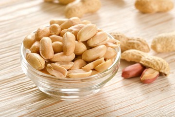 salted peanuts on wooden background