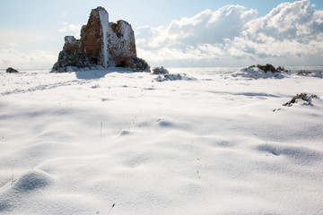 Uluzzo tower after a exceptional snowfall, Salento