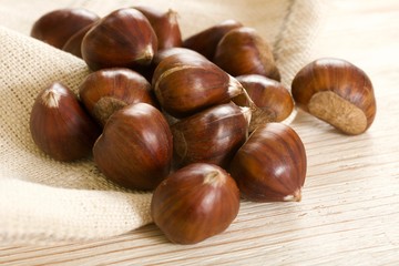 chestnuts on a wooden background