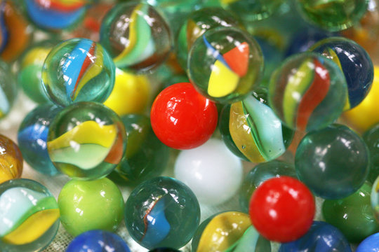 A Variety Of Colorful Glass Marbles For Playing A Game