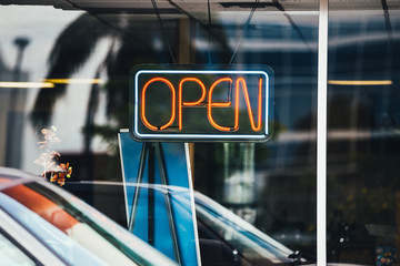Open sign on a street shop window