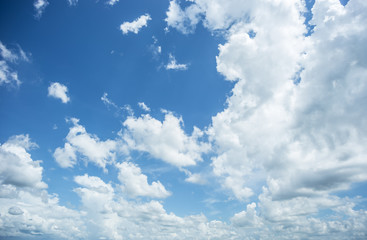 blue sky background with puffy white cloud