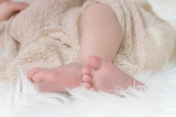 The legs of a newborn baby closeup