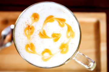 Hot coffee in a white cup on table