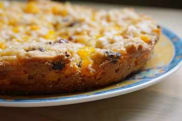 Homemade pumpkin pie on a plate close up. Selective focus.