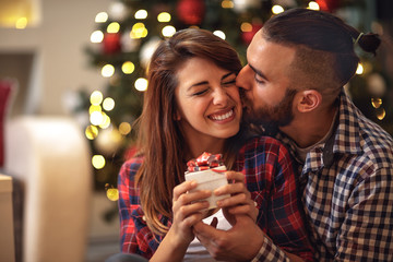 Boyfriend kiss woman on Christmas Eve