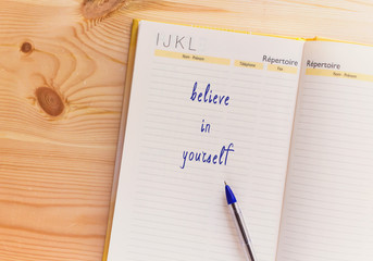 Believe in Yourself written on notepad