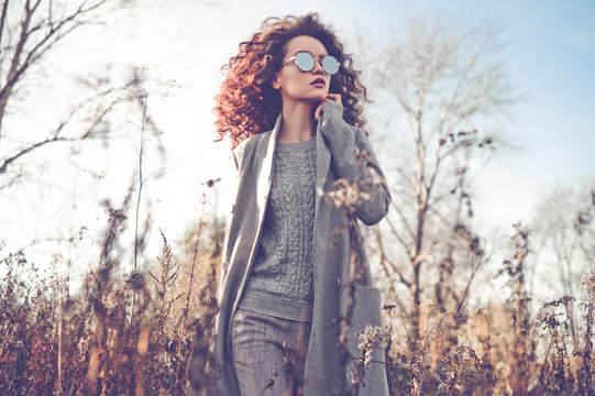 Fashion Beautiful Lady In Autumn Landscape