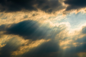 Fototapeta na wymiar Sun rays through clouds like an dramatic explosion