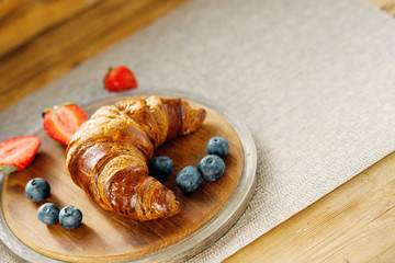 Fresh croissant and berries 