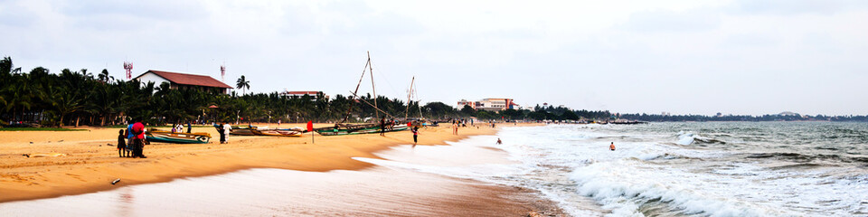 Beach at Negombo, Sri Lanka with evening cloudy sky