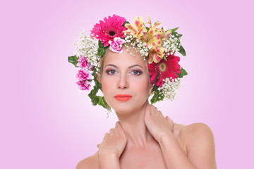 portrait of a beautiful girl with a hairdress from flowers