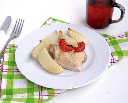 Chicken baked in sour cream sauce, with potatoes and tomatoes