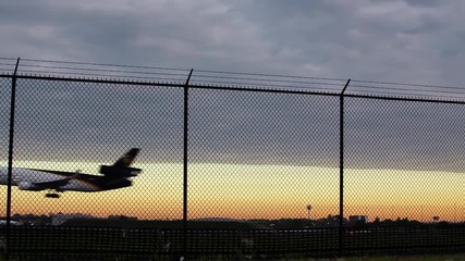 PHILADELPHIA - MAY 3, 2010: UPS airplane landing in Philadelphia, PA at dusk on May 3rd, 2010.