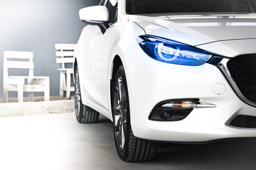 BANGSAN, THAILAND - OCTOBER, 13, 2017 :  Led headlight car mazda brand japan parked in showroom of...