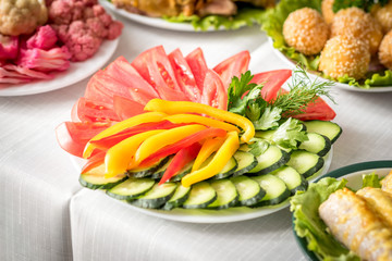 Sliced cucumber, sweet pepper, tomato and parsley