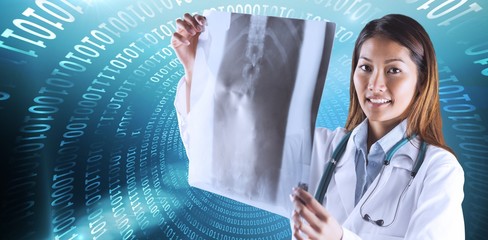 Composite image of asian doctor checking mri scan