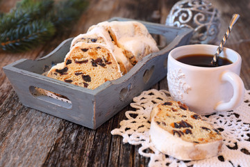 Stollen, traditional Christmas cake and cup of coffee