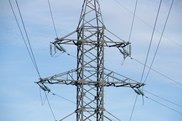 reliance power on the background of blue ,transmission line tower