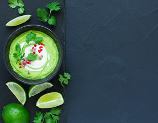 Delicate soup with avocado, with lime and cilantro.
