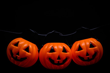 Hanging many horror or scary pumpkin for Halloween Day concept, space for your content.