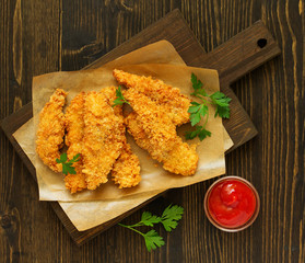 Chicken strips with ketchup. view from above.