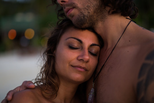 Close Up of an Anonymous Man Embracing Woman