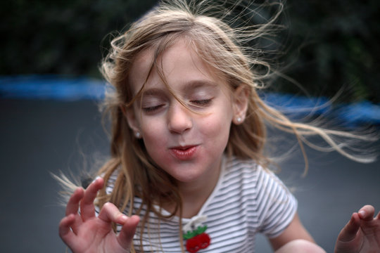 Young Girl Meditating With Her Eyes Closed