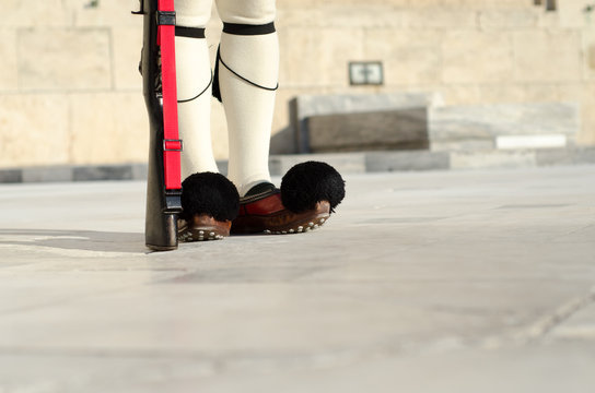 Evzones Greeces historic presidential guard.Tsarouhi is a type of shoe, which is typically known nowadays as part of the traditional uniform worn by the Greek guards known as Evzones