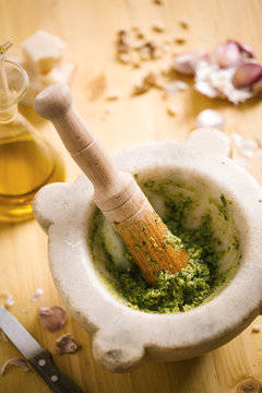 Preparing homemade pesto sauce
