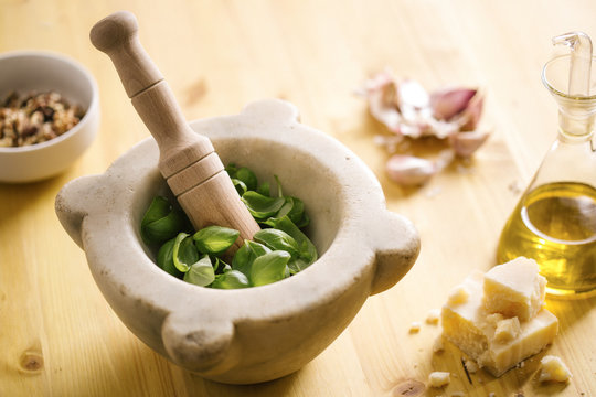 Preparing homemade pesto sauce