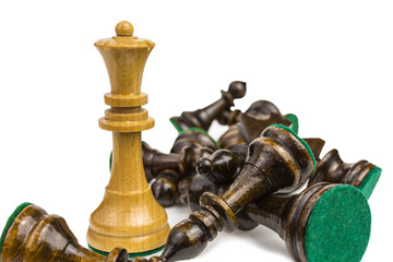 victorious chess queen surrounded by slain pieces