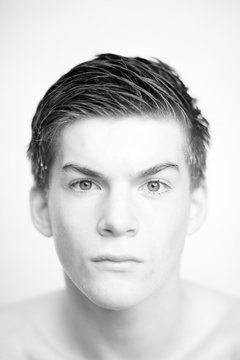 Black and white headshot of a young man