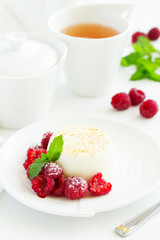 Delicious home-made dessert Panna cotta. Cream-caramel, caramel custard, with raspberries.