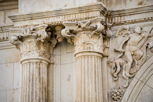 Columns, Details of stone sculptures of the facade of the University of Alcal&aacute; de Henares. Madrid, Spain.