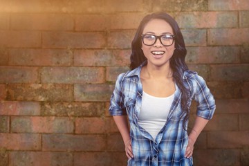 Composite image of asian woman smiling to the camera