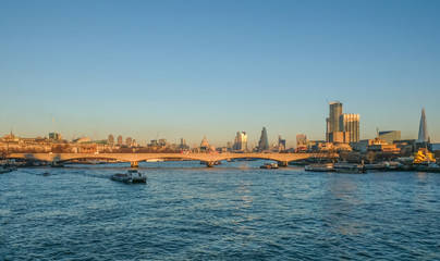 London skyline view of Waterloo Bridge and the City and the south side of the River Thames.